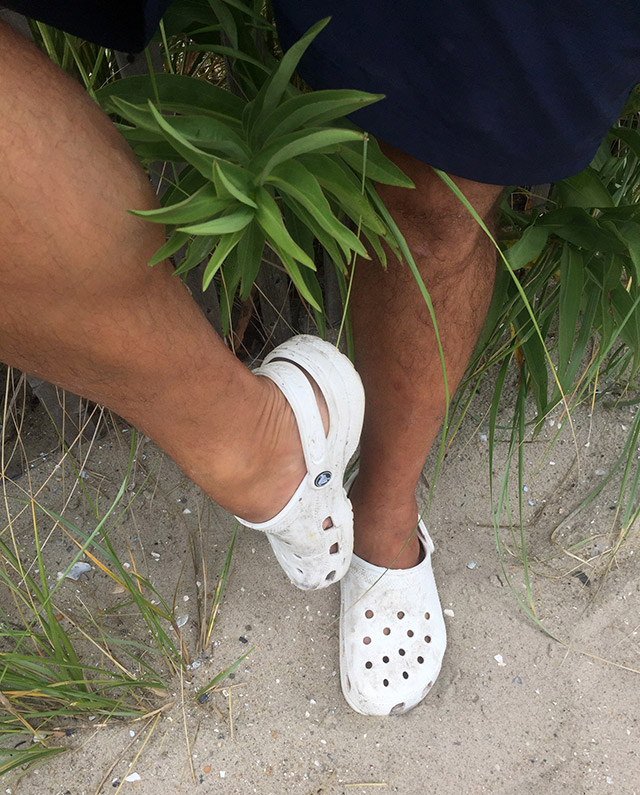 Rob-Bryn-hanging-out-on-the-beach-in-his-crocs